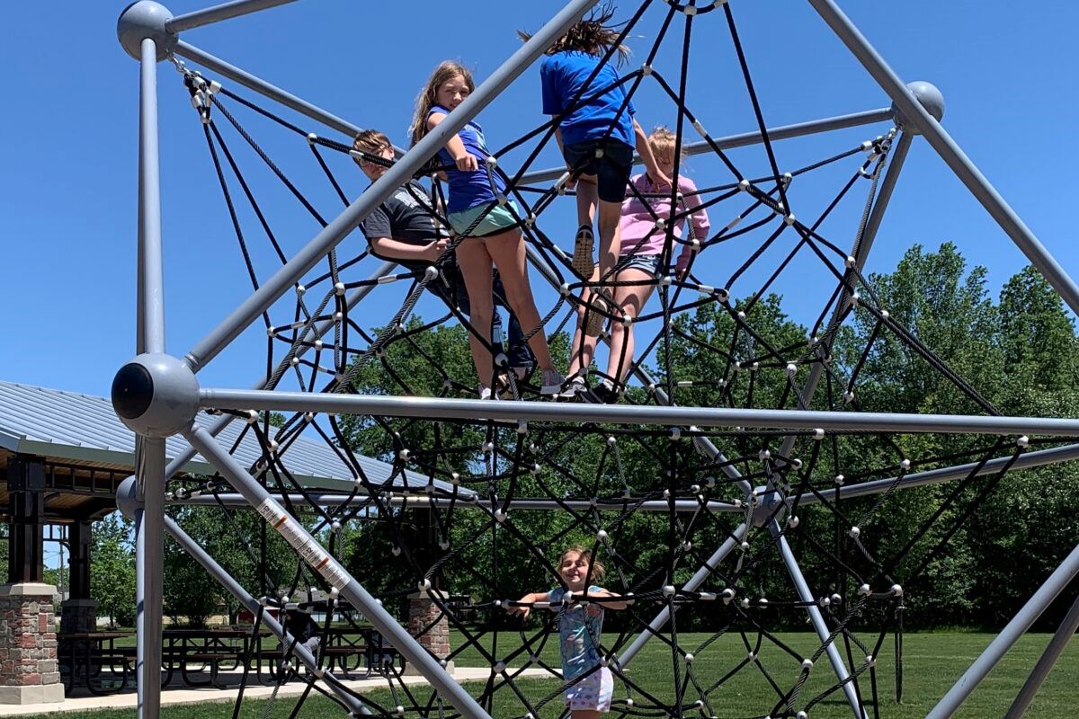 Children Playing on Playground Equipment